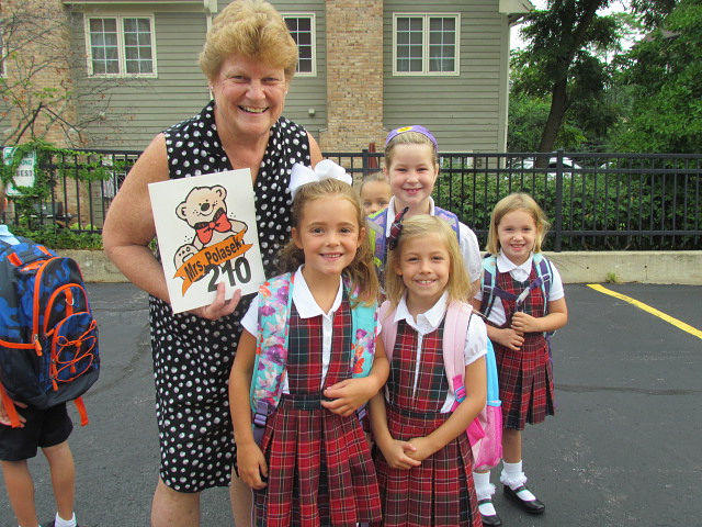 Teacher with group of St Pets students in uniform